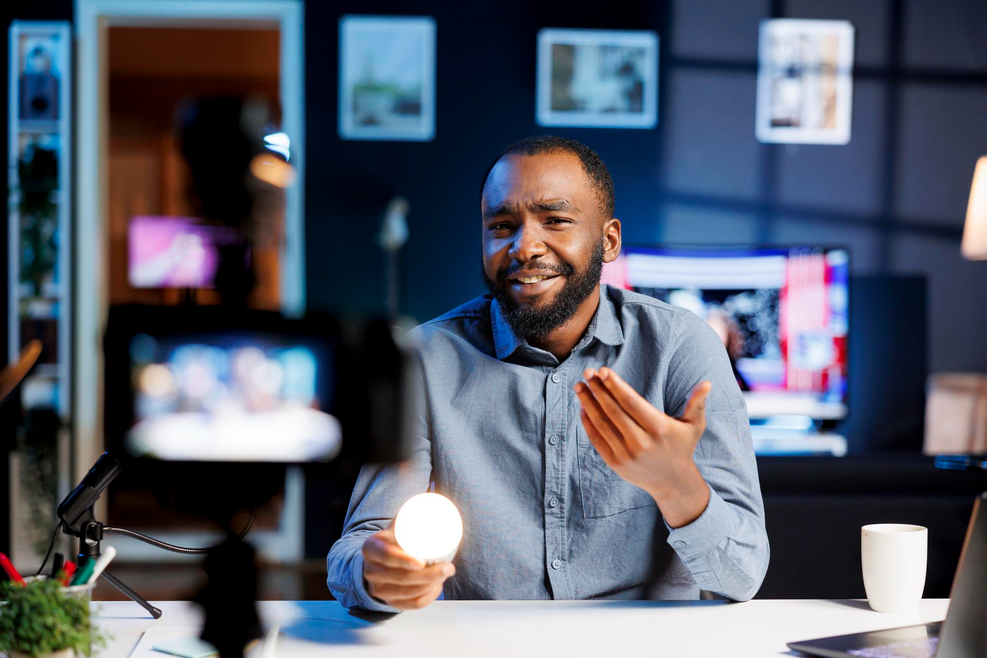 A business professional holding a shining light bulb to illustrate innovation through a better digital presence.